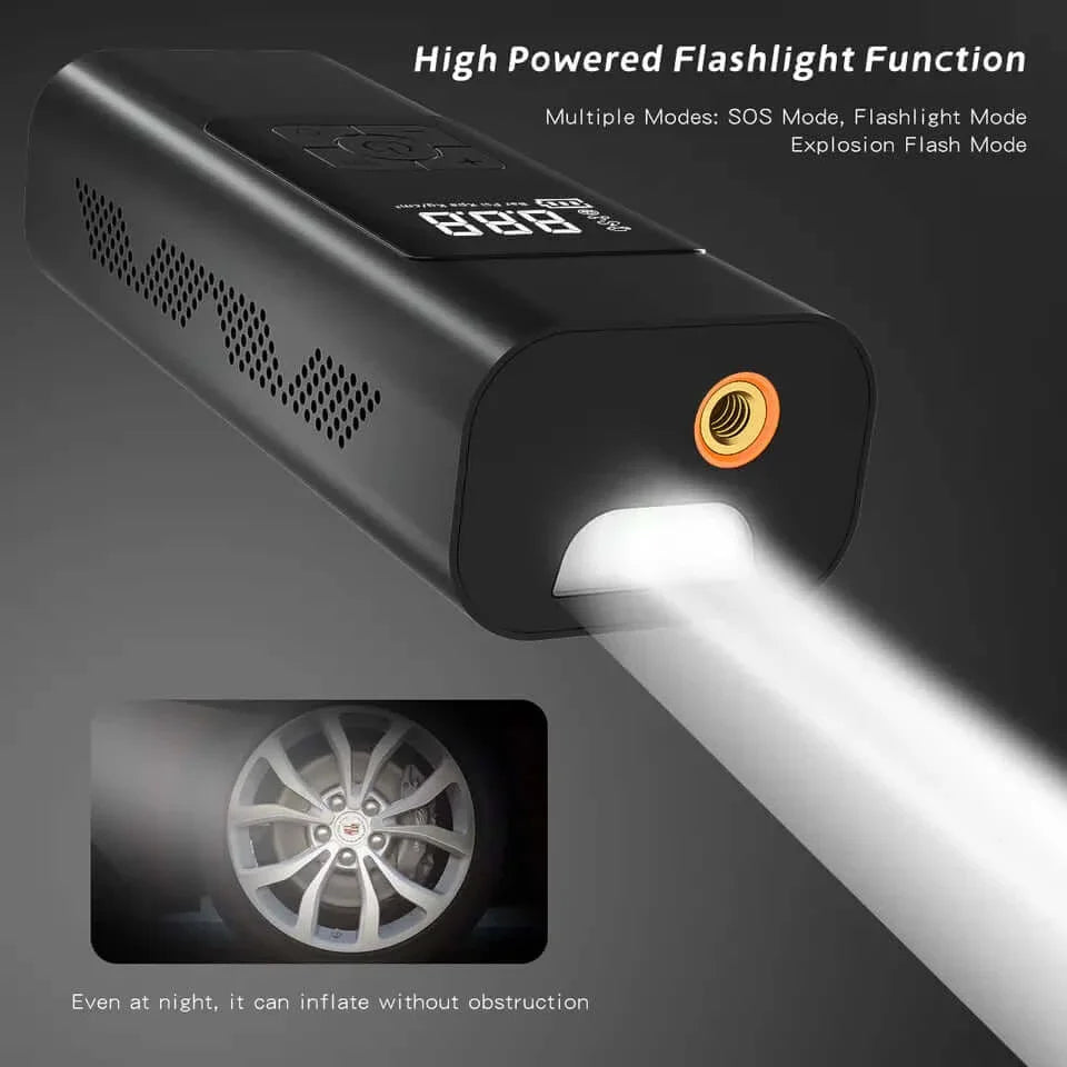 A black portable tyre air pump with a flashlight function emitting a bright beam.