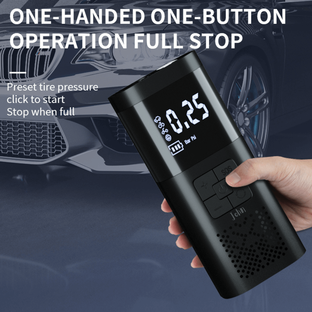 A hand holding a black portable air inflator with a digital display reading "0.25 Bar PSI". The background shows a car's front end. 